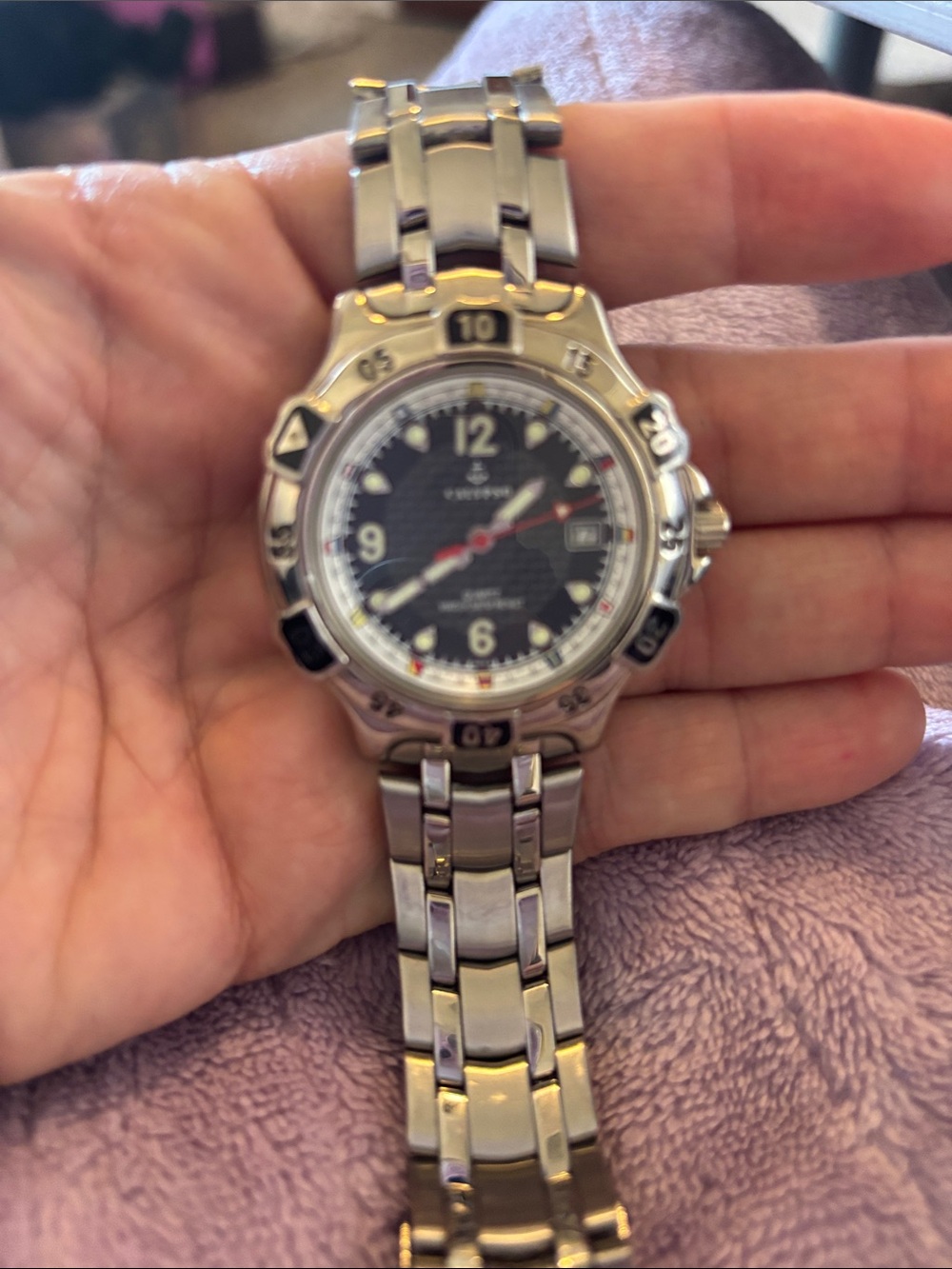 Invicta Silver Stainless Steel Watch with Black Dial and Red Accents
